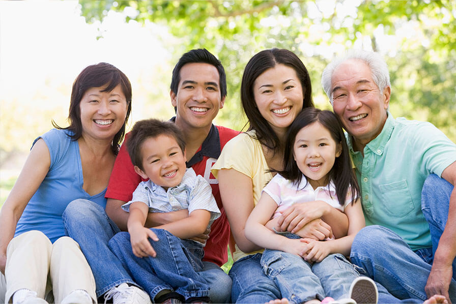 A family smile at the camera