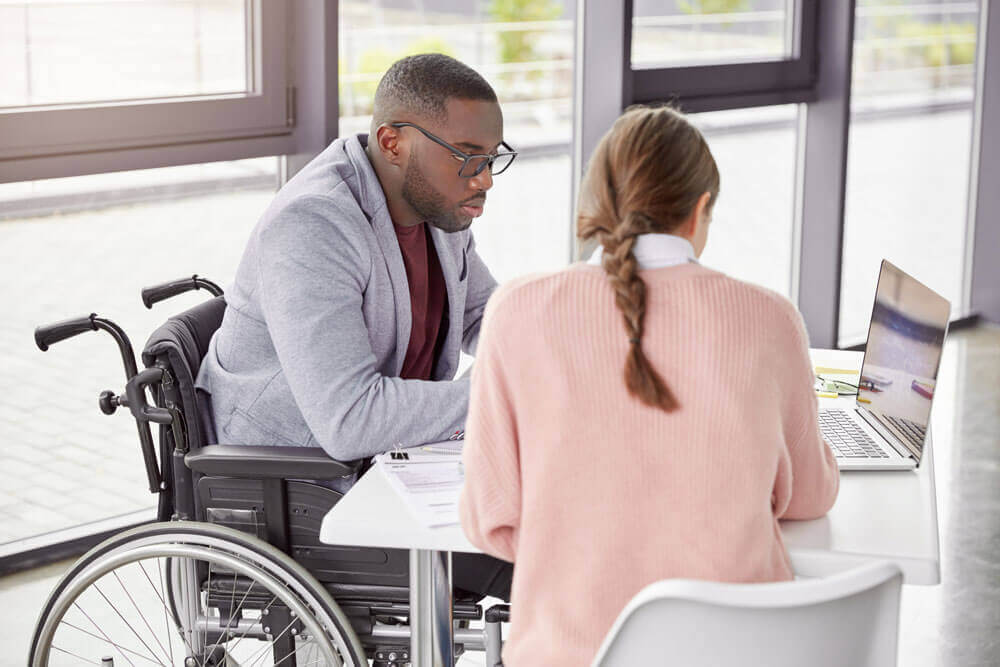 Two people planning on a laptop