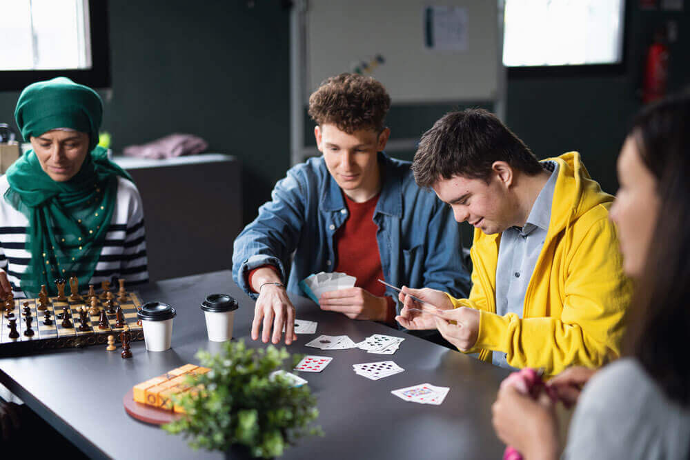 A group of people playing board games 