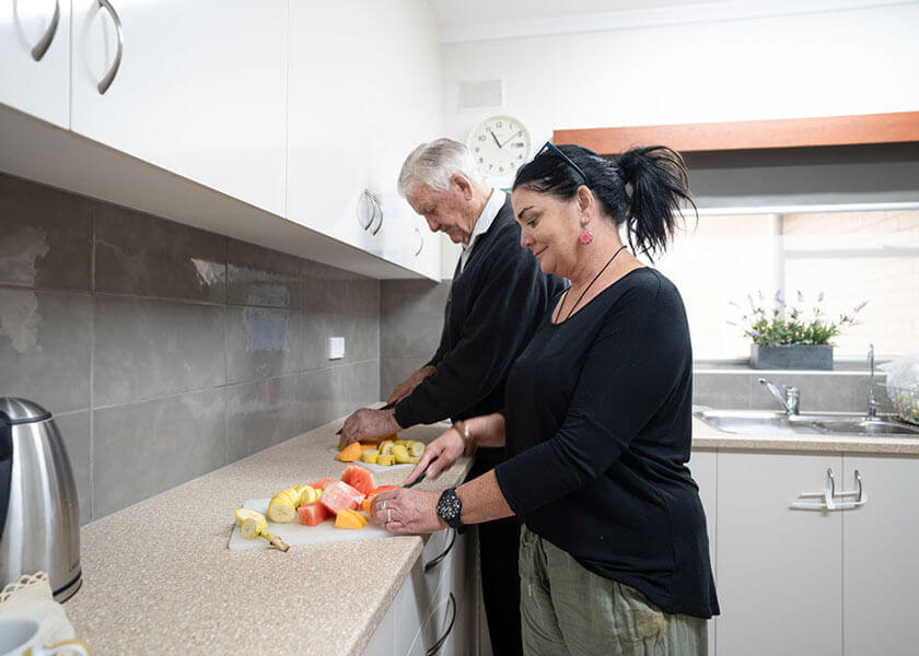 Two people preparing food