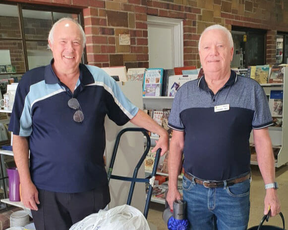 Two-male-volunteers-helping-at-the-op-shop Two-male-volunteers-helping-at-the-op-shop